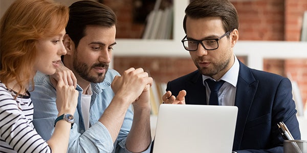 Couple being educated by an advisor about cyber threats