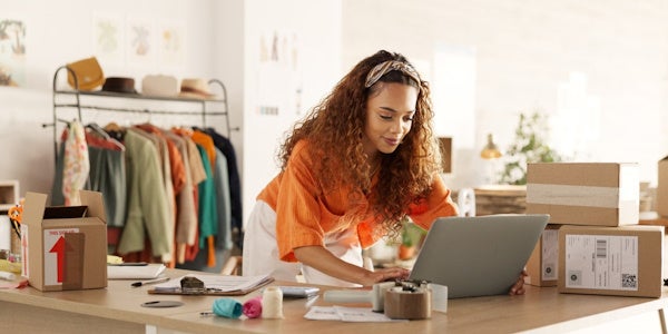 Woman selling clothes for her small business